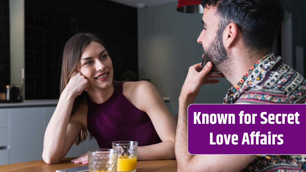 Content couple chatting and having orange juice in kitchen.