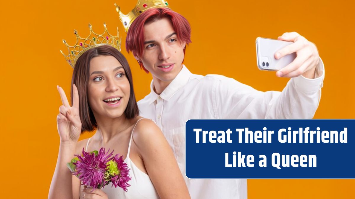 Wedding couple groom and bride with bouquet of flowers in wedding dress wearing gold crowns smiling cheerfully doing selfie using smartphone standing over orange wall.